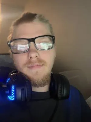 Gamer at a headset setup during a late-night session